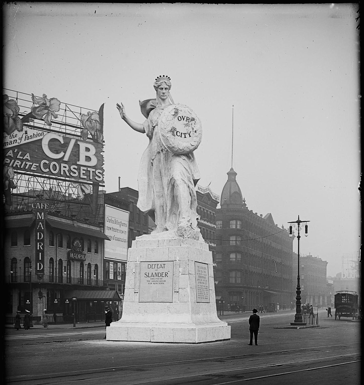 Corner of 1551 Broadway, c1909, with a temporary plaster statue nicknamed "Purity" and a construction banner for the new Globe Theatre