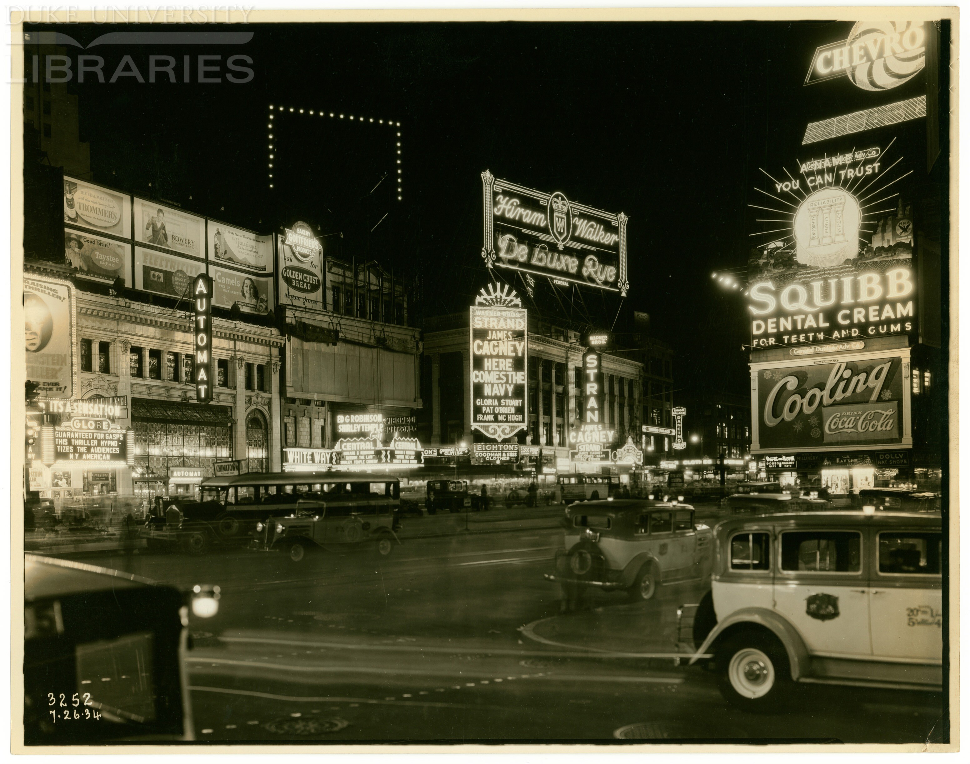 The vertical AUTOMAT sign lights-up the night on the west side of the square. A likely comfort to the patrons exiting the showing of Frankenstein at the Globe Theatre next door. July 26, 1934.