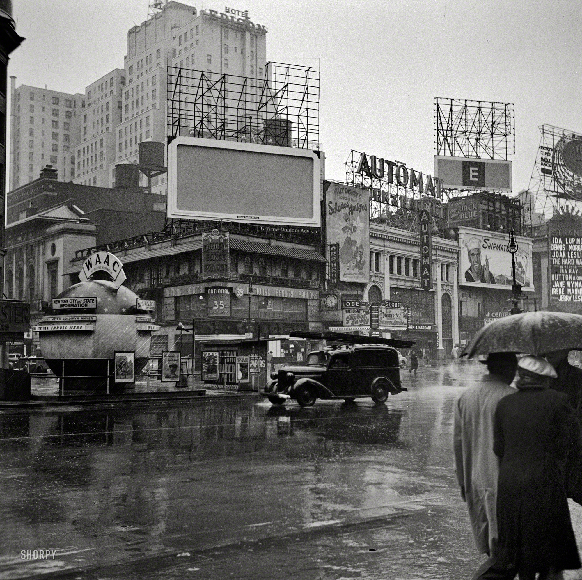 Rainy day at the Globe Theatre corner, March 1943, John Vachon
