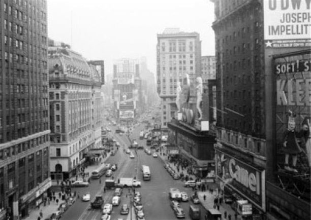 Times Square looking north with Bond statues and traffic in the 1950s