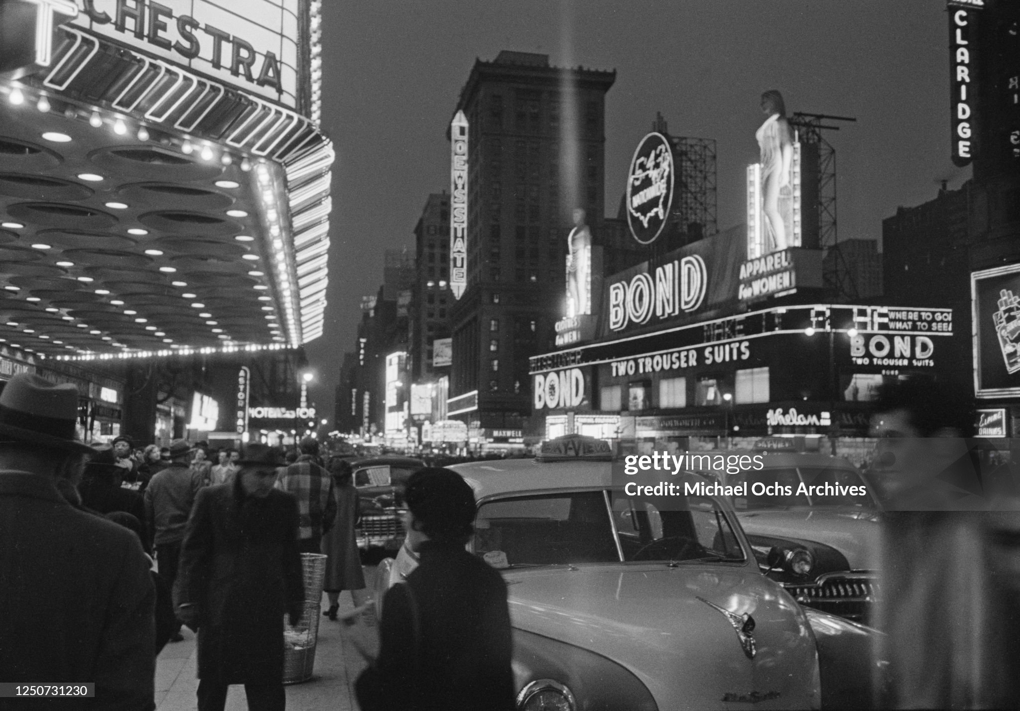 Another night shot of the Bond statues illuminated with neon clothing in 1952