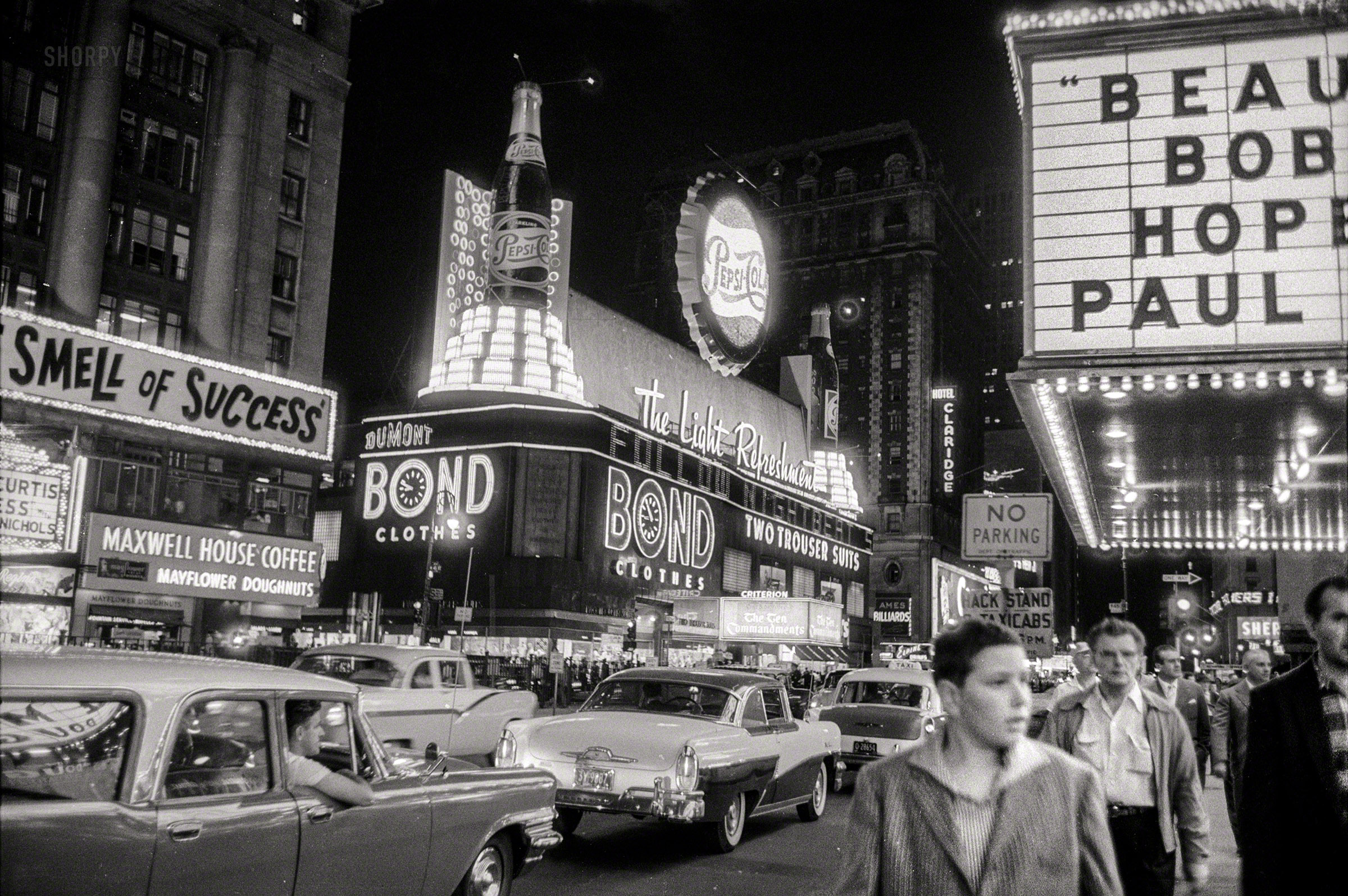 Times Square with cars and Bond sign, The Light Refreshment, 1957