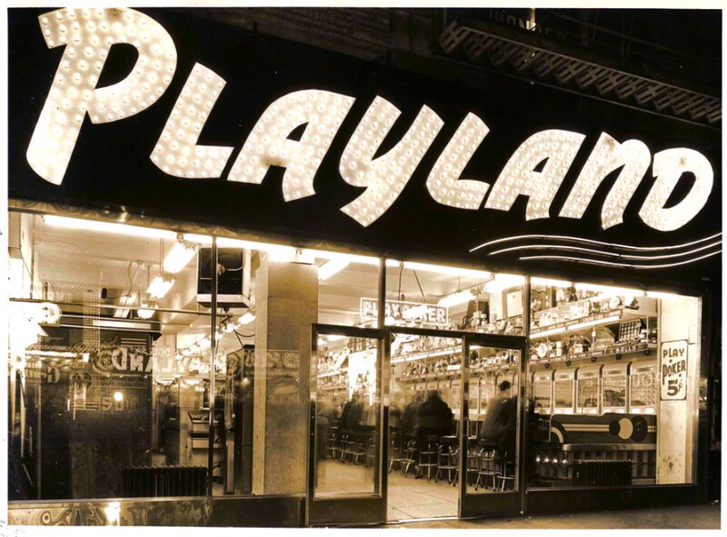 Playland arcade interior and sign, 1960s