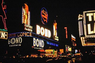 Bond Clothing neon statues illuminated at night
